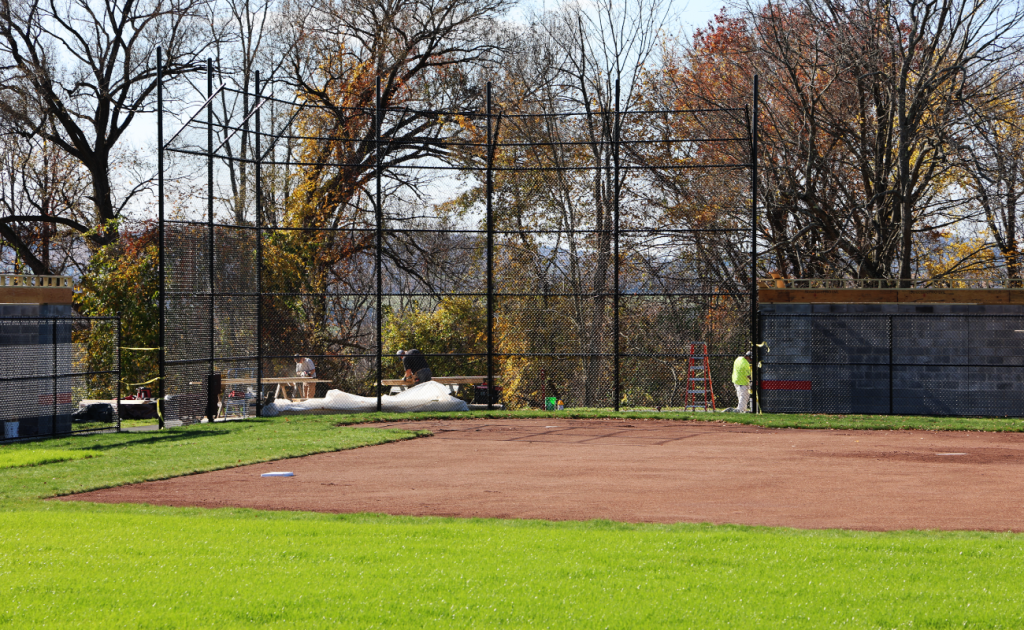 view of the softball field backstop from the outfield