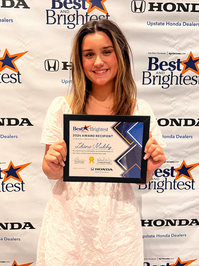 Lily Mulchy holding her award certificate